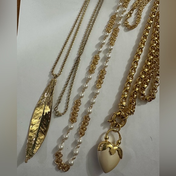 Jewelry - 3 assorted Gold necklaces with charms